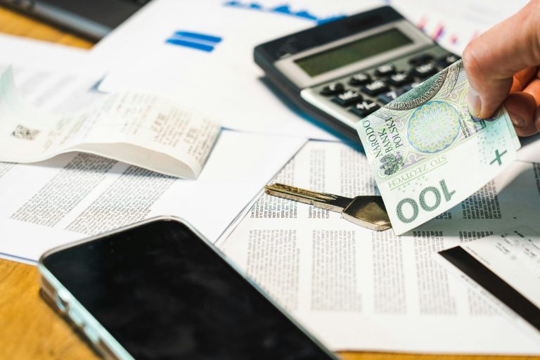 Cash, key, and documents on desk