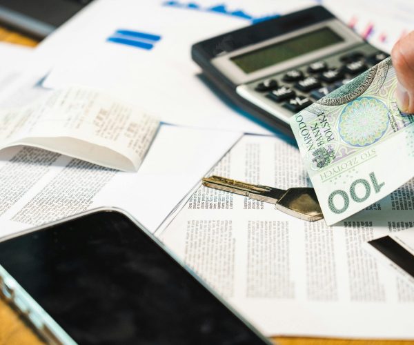 Cash, key, and documents on desk